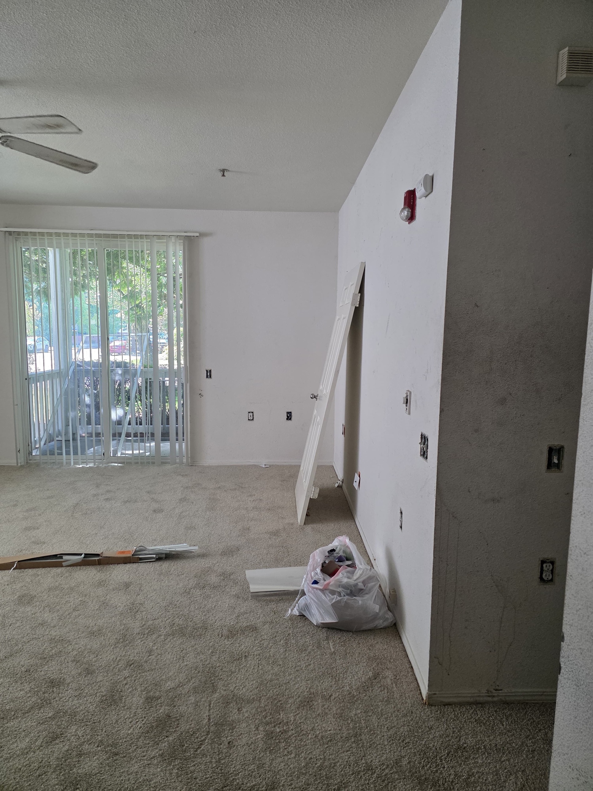 Living room before repaint, debris cleared during prep