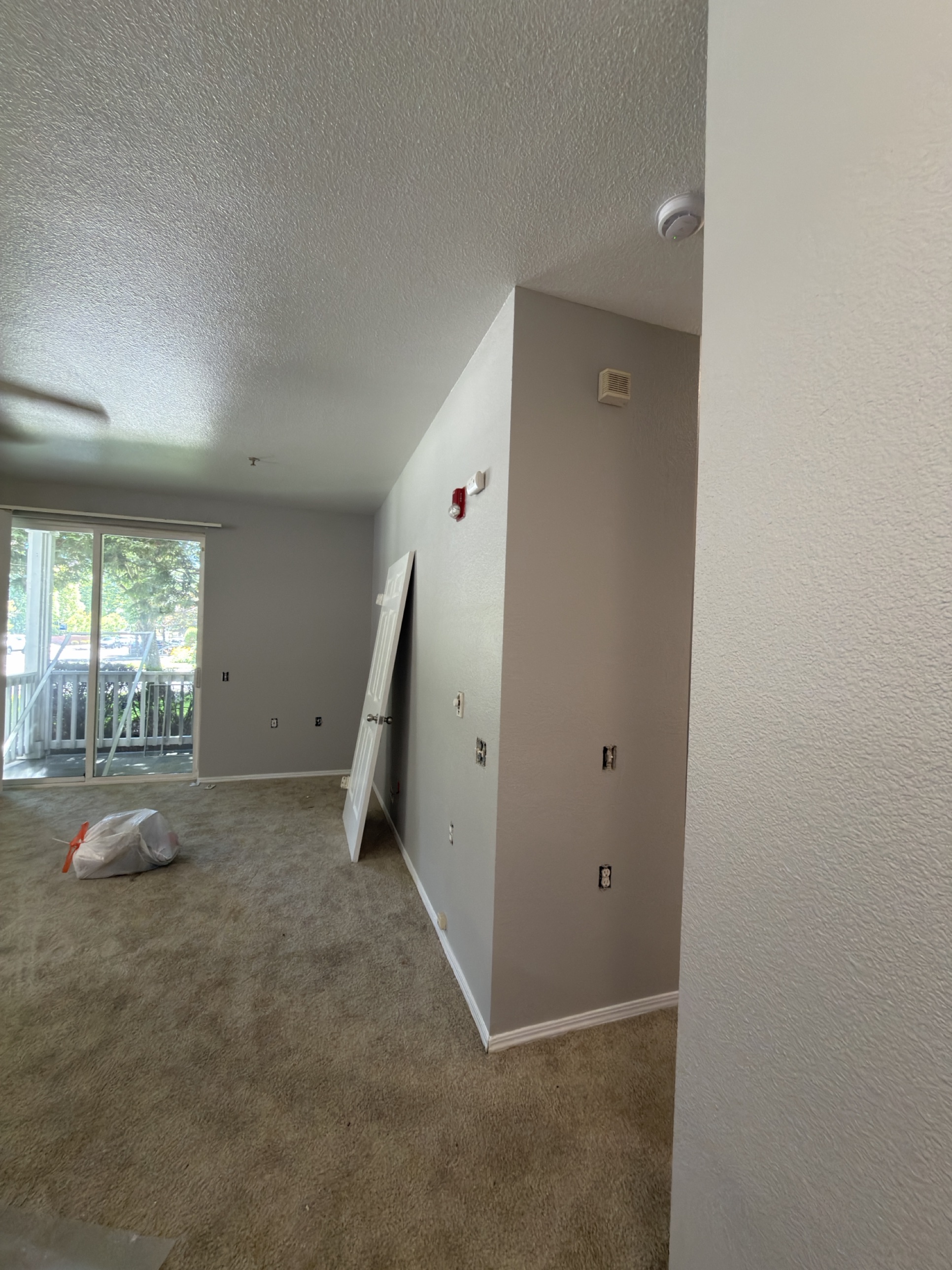 Living room mid-prep, ready for paint
